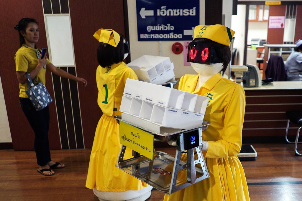 Robots wearing nurse costumes carry medical documents at Mongkutwattana General Hospital in Bangkok, Thailand, February 6, 2019. REUTERS/Athit Perawongmetha - RC141A92D000