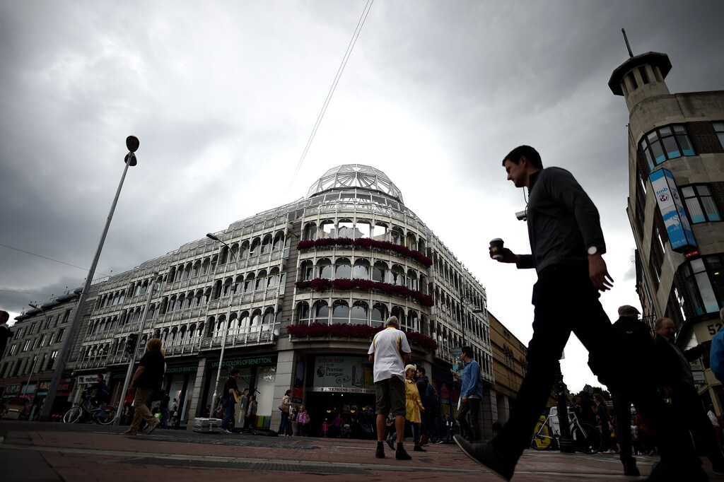 A man walks on Grafton Street in Dublin, Ireland August 14, 2017. Picture taken August 14, 2017. REUTERS/Clodagh Kilcoyne - RC17631C4900