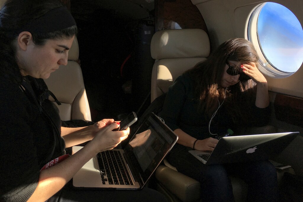 Members of the media work on press charter plane following U.S. Republican presidential candidate Marco Rubio in Myrtle Beach, South Carolina, U.S., February 11, 2016. REUTERS/Carlo Allegri SEARCH "ELECTION SIDELINES" FOR THIS STORY. SEARCH "THE WIDER IMAGE" FOR ALL STORIES. - RTSHYFS