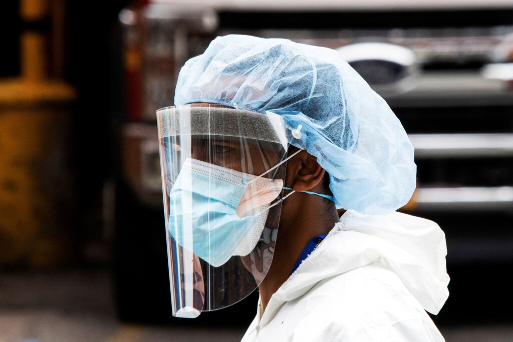PPE suit Elmhurst Hospital center outbreak coronavirus disease COVID19 Queens New York U.S. America healthcare worker nurse doctor