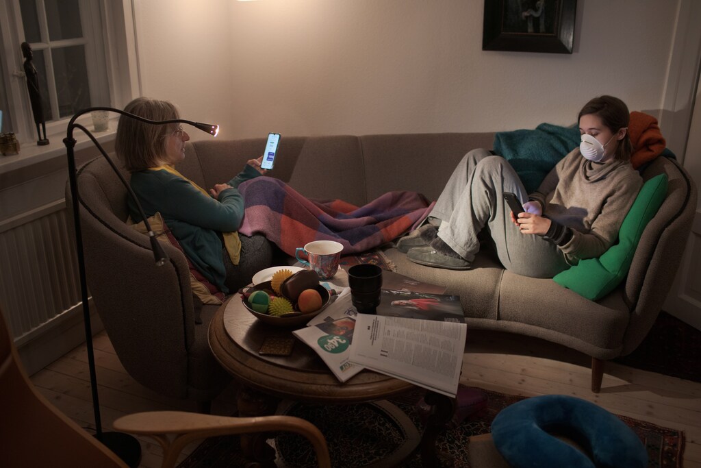 Reuters photographer Nora Savosnick and her mother, Chava Savosnick, look at their phones while sitting in their living room, as Nora completes 14-days of quarantine since arriving from New York, during the coronavirus disease (COVID-19) outbreak, in Oslo, Norway, March 30, 2020. "The best part is that I'm getting a lot closer to you guys, and I don't think I would ever get this close if it hadn't been for me literally being locked down in this house. ... And I think a lot of people will come out of this knowing the people they lived in the house with better. And I'm very grateful for that" said Nora. REUTERS/Nora Savosnick SEARCH "SAVOSNICK QUARANTINE" FOR THIS STORY. SEARCH "WIDER IMAGE" FOR ALL STORIES. THE IMAGES SHOULD ONLY BE USED TOGETHER WITH THE STORY - NO STAND-ALONE USES. TPX IMAGES OF THE DAY. - RC2DWF9J03P6