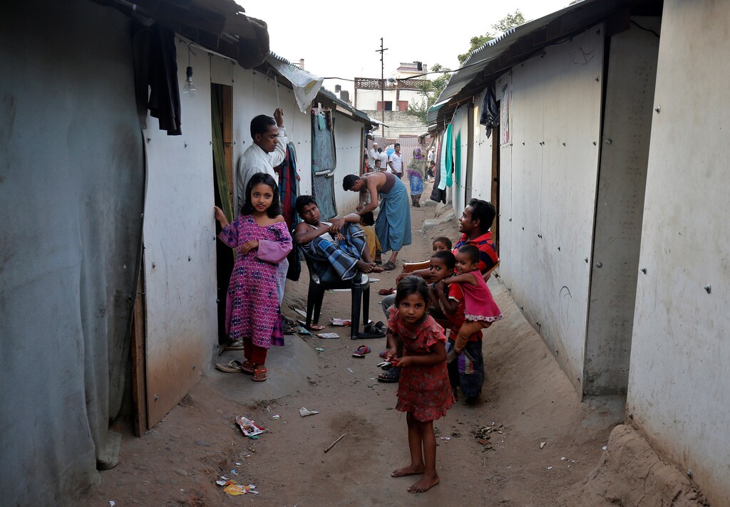 People belonging to Rohingya Muslim community sit outside their makeshift houses on the outskirts of Jammu, May 5, 2017. Picture taken on May 5, 2017. REUTERS/Mukesh Gupta - RTS16BTA