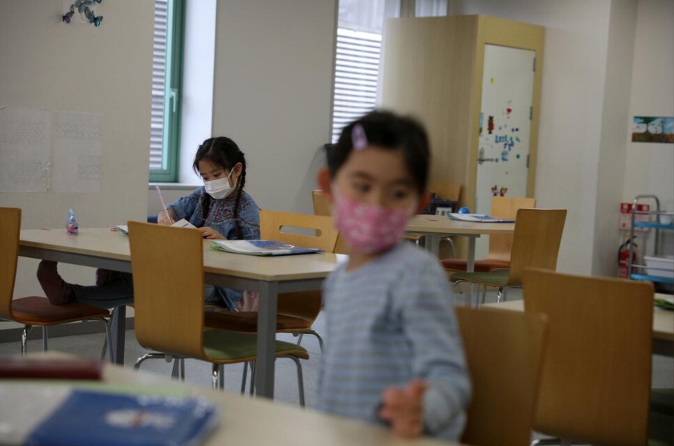 A child, wearing a protective face mask, following an outbreak of coronavirus, is seen at "Stella Kids", daycare center in Tokyo, Japan, March 5, 2020.