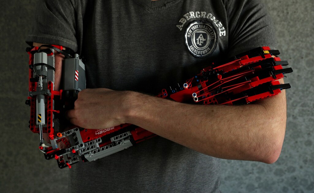 David Aguliar poses with his prosthetic arm built with Lego pieces during an interview with Reuters in Sant Cugat del Valles, near Barcelona, Spain, February 4, 2019. Picture taken on February 4, 2019. REUTERS/Albert Gea - RC1BF7CA94E0
