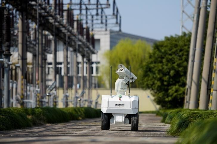 A robot inspects power equipment at an electrical substation of the State Grid Corporation of China in Jiaxing, Zhejiang province, China March 12, 2018. REUTERS/Stringer ATTENTION EDITORS - THIS IMAGE WAS PROVIDED BY A THIRD PARTY. CHINA OUT.