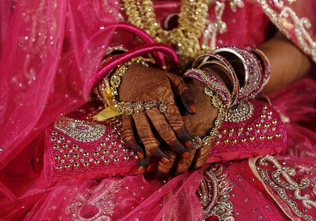 A Muslim bride waits for the start of a mass marriage ceremony in Mumbai, India, January 27, 2016. A total of 12 Muslim couples took their wedding vows during the mass marriage ceremony organised by a Muslim voluntary organisation, organisers said.
