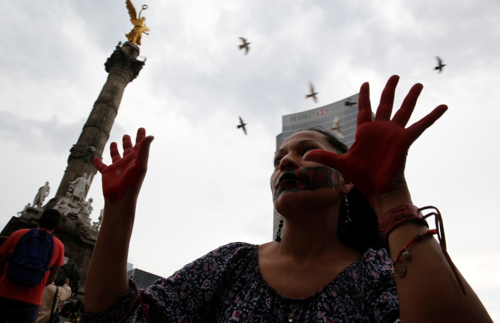 An activist takes part in a protest against journalists who have been killed in Mexico during a demonstration at the Angel of Independence monument in Mexico City, Mexico May 30, 2017. REUTERS/Henry Romero - RTX38AQ5