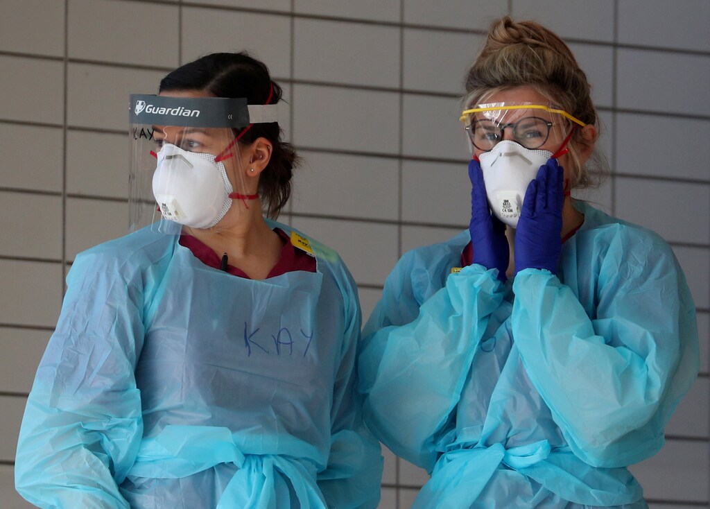 Medical staff wearing protective clothing at St Thomas' hospital as the spread of the coronavirus disease (COVID-19) continues, London, Britain, March 31, 2020. REUTERS/Hannah McKay TPX IMAGES OF THE DAY - RC2WUF9E7Q01