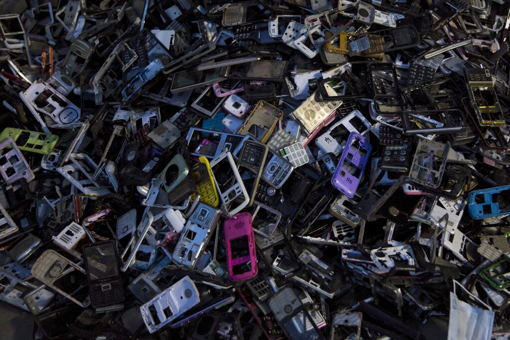Old cellular phone components are discarded inside a workshop in the township of Guiyu in China's southern Guangdong province June 10, 2015.
