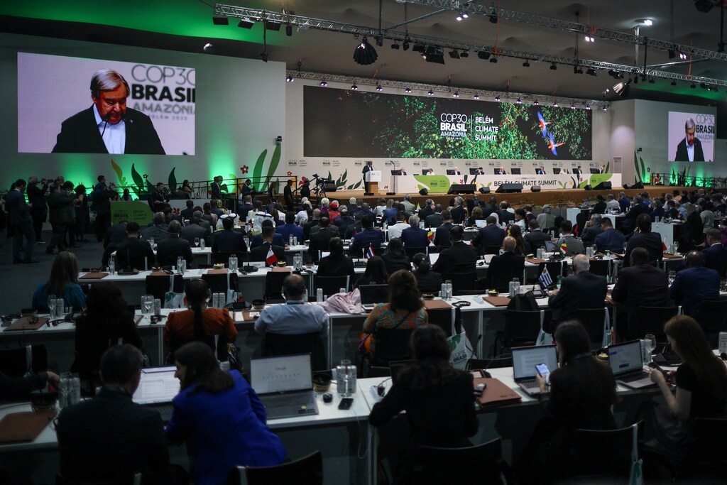 United Nations Secretary-General Antonio Guterres appears on screens as he speaks at the opening of the Belem Climate Summit plenary session, as part of the United Nations Climate Change Conference (COP30), in Belem, Brazil, November 6, 2025: Multilateralism: New multilateral partnerships are reshaping global collaboration
