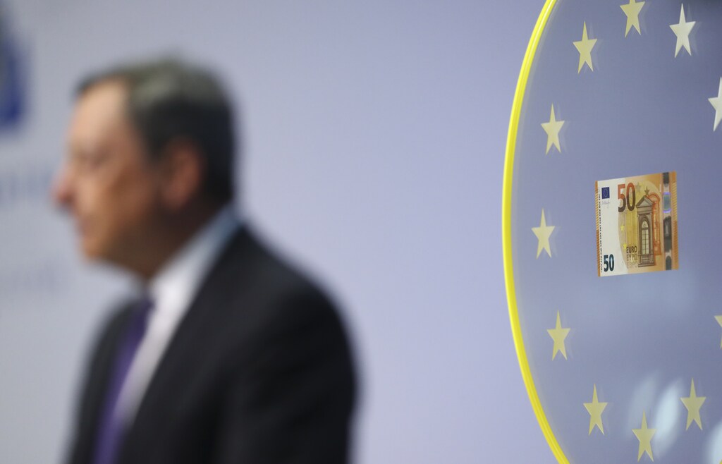 Mario Draghi, President of the European Central Bank (ECB) is pictured next to a new 50 Euro banknote during a news conference at the ECB headquarters in Frankfurt April 4, 2017. REUTERS/Kai Pfaffenbach - RTX341CP