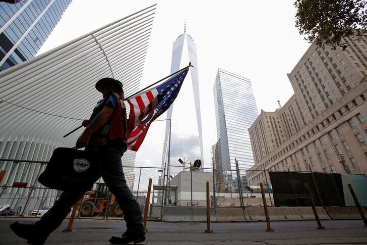 A man arrives at the World Trade Center complex on the morning of the 15th anniversary of the 9/11 attacks in Manhattan, New York, U.S., September 11, 2016. REUTERS/Andrew Kelly
