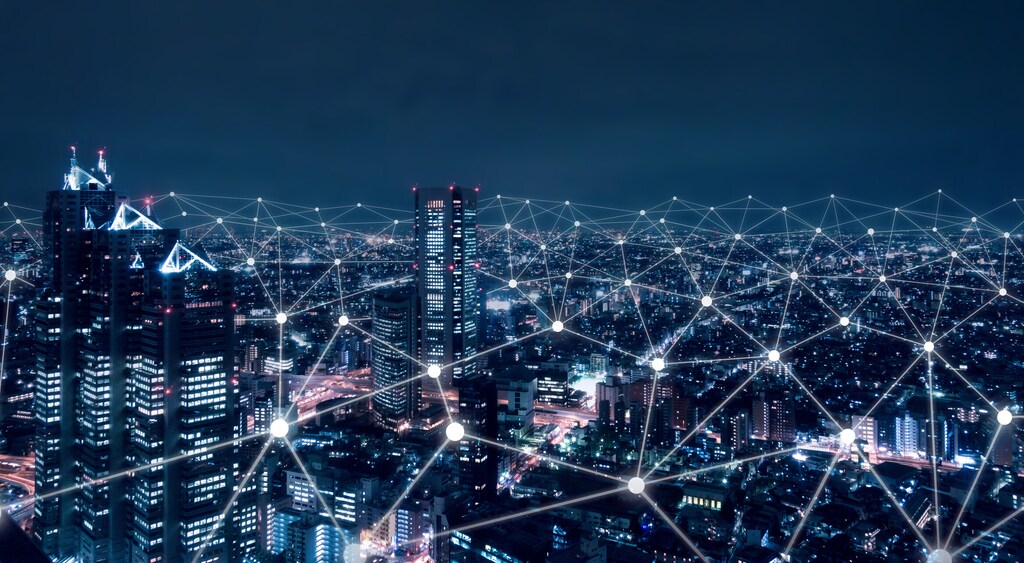 Telecommunication network above city, wireless mobile internet technology for smart grid or 5G LTE data connection, concept about IoT, global business, fintech, blockchain. Energy technology, data-driven energy system, AI