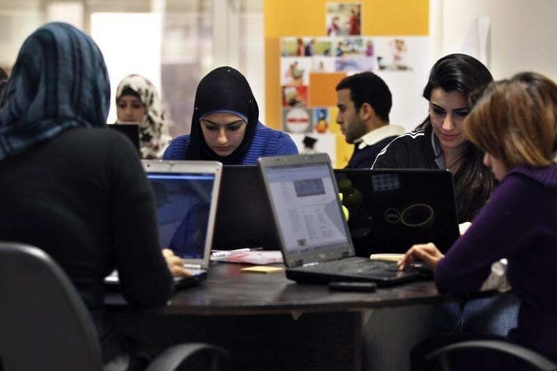 Young entrepreneurs work on their laptops at the Amman-based Oasis 500, a seed investment firm which finances start-up firms in the region's information technology sector, November 2, 2011. Across the Middle East and North Africa, the Arab Spring uprisings have hurt many businessmen. Economies have slowed sharply as political uncertainty deters investment, new governments focus on trying to restore social stability instead of reforming economic policy, and labour unrest disrupts production and drives up costs. Oasis 500's Executive Chairman Usama Fayyad said governments had become more careful about appearing even-handed towards companies, even in countries that have been relatively untouched by the Arab Spring. In the long term, though, a cleaner, fairer business environment could, even more than other economic reforms such as deregulation and fiscal policy changes, help to solve one of the Arab world's biggest problems: job creation. A more level playing field could spur the growth of similar small and medium-sized firms. Picture taken November 2, 2011. To match Mideast Money ARAB-BUSINESS/SPRING REUTERS/Muhammad Hamed (JORDAN - Tags: BUSINESS SCIENCE TECHNOLOGY) - GM1E7B91IZK01