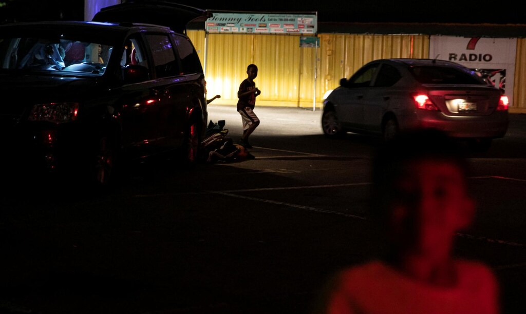 People leave after watching a movie at a drive-in theatre while keeping social distancing following the outbreak of the coronavirus disease (COVID-19) in Fort Lauderdale, Florida, U.S., March 28, 2020.