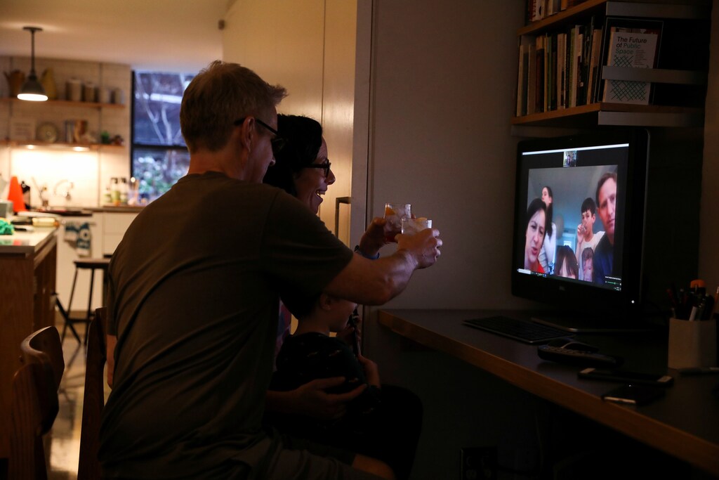 Naomi and her husband Doug Hassebroek enjoy a happy hour and cheers friends and family from their home using Zoom to connect digitally at the end of their first Friday working from home due to concerns over the rapid spread of coronavirus disease (COVID-19) in Brooklyn, New York, U.S., March 20, 2020 Coronavirus china virus health healthcare who world health organization disease deaths pandemic epidemic worries concerns Health virus contagious contagion viruses diseases disease lab laboratory doctor health dr nurse medical medicine drugs vaccines vaccinations inoculations technology testing test medicinal biotechnology biotech biology chemistry physics microscope research influenza flu cold common cold bug risk symptomes respiratory china iran italy europe asia america south america north washing hands wash hands coughs sneezes spread spreading precaution precautions health warning covid 19 cov SARS 2019ncov wuhan sarscow wuhanpneumonia pneumonia outbreak patients unhealthy fatality mortality elderly old elder age serious death deathly deadly