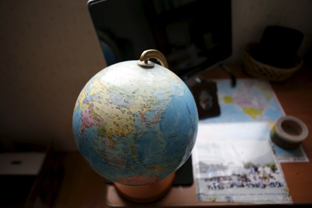 A globe is seen on a desk in a room belonging to Jeon Hyeon-tak, a high school student who died in the Sewol ferry disaster, in Ansan April 8, 2015. Nearly a year after the Sewol ferry sank on April 16, 2014, with the death of 250 students, some families keep their childrens bedrooms intact to remember and honour their loved ones. More than 300 people, most of them students and teachers from Danwon High School, are dead, or missing and presumed dead, after the Sewol ferry sank on a routine trip from the port of Incheon, near Seoul, to the holiday island of Jeju. REUTERS/Kim Hong-Ji - GF10000057088