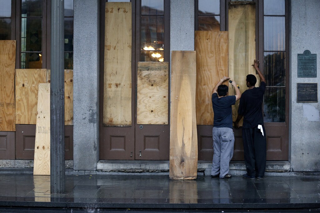 Business owners board up their restaurant in the French Quarter as Hurricane Nate approaches the U.S. Gulf Coast in New Orleans, Louisiana, U.S. October 7, 2017. REUTERS/Jonathan Bachman - RC1765E2CC60