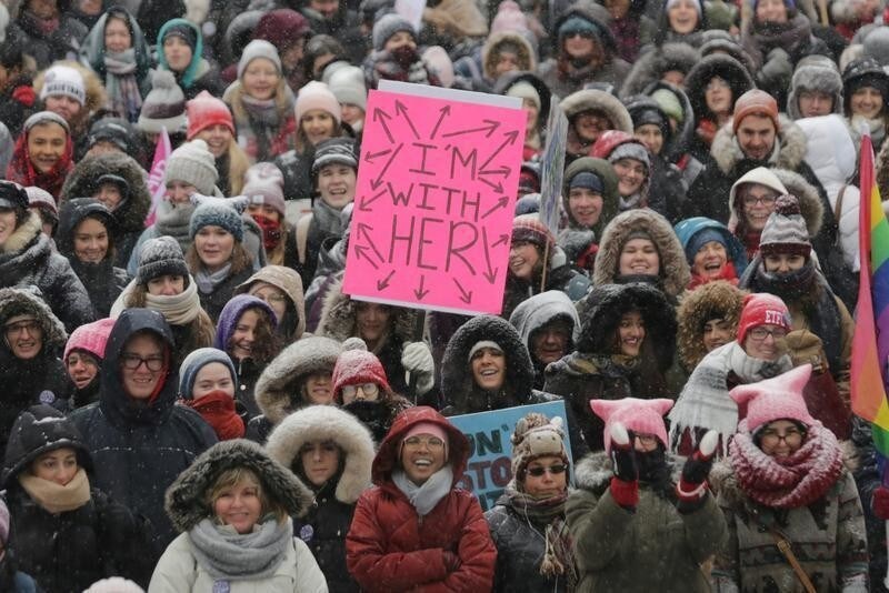 Participants listen to speakers outside City Hall during the Women's March in a -22 Celsius (-8 Fahrenheit) wind chill snow storm in Toronto, Ontario, Canada January 19, 2019. REUTERS/Chris Helgren TPX IMAGES OF THE DAY - RC1B270B48E0