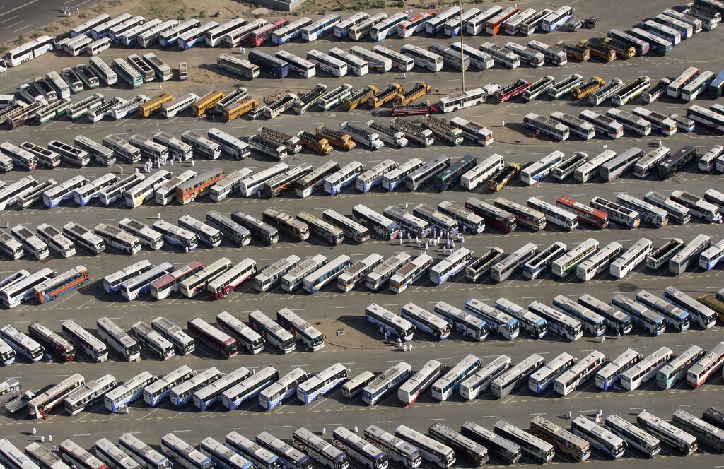 An aerial view of buses for Muslim pilgrims is seen in a parking lot outside Mecca December 7, 2008. More than two million Muslims began the haj pilgrimage on Saturday, heading to a tent camp outside the holy city of Mecca to follow the route Prophet Mohammad took 14 centuries ago. REUTERS/Susan Baaghil (SAUDI ARABIA) - GM1E4C71IEJ01