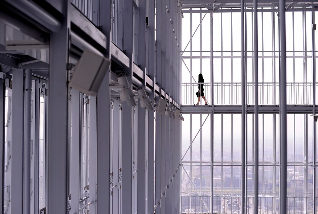 A woman walks inside the new Intesa Sanpaolo skyscraper, designed by Italian architect Renzo Piano, in Turin April 10, 2015.