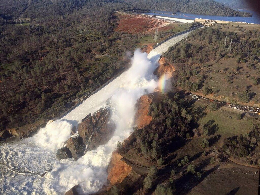 A damaged spillway with eroded hillside is seen in an aerial photo taken over the Oroville Dam in Oroville, California, U.S. February 11, 2017. California Department of Water Resources/William Croyle/Handout via REUTERS ATTENTION EDITORS - THIS IMAGE WAS PROVIDED BY A THIRD PARTY. EDITORIAL USE ONLY. THIS PICTURE WAS PROCESSED BY REUTERS TO ENHANCE QUALITY. AN UNPROCESSED VERSION HAS BEEN PROVIDED SEPARATELY. TPX IMAGES OF THE DAY - RTSYD5R