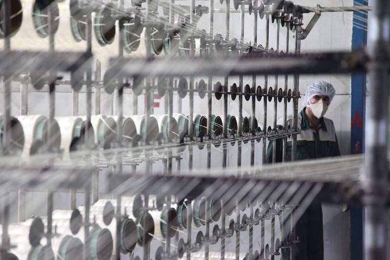 An employee works at a carbon fiber factory of the defence ministry in Tehran August 27, 2011. Iran on Saturday inaugurated the plant, the first in producing carbon fiber which is a material the country is banned from importing due to international sanctions targeting dual-use materials, according to IRNA news agency.