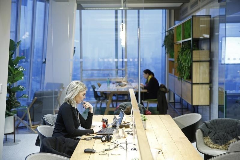 Workers sit at their desks at the Jellyfish office space in London, Britain December 19, 2016. Picture taken December 19, 2016.