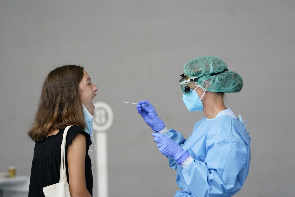 A medical worker administers a PCR test to a resident of the Basque town of Azpeitia, Spain, amid a localised outbreak of the coronavirus disease (COVID-19), August 17, 2020. REUTERS/Vincent West - RC2SFI9KI36K