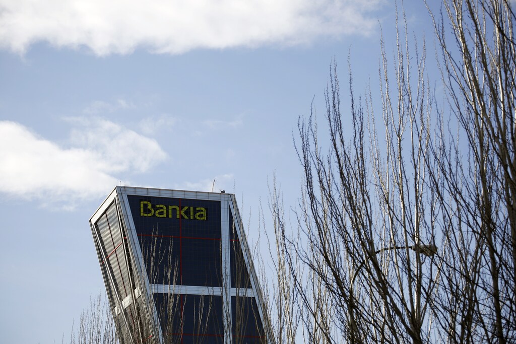 The headquarters of Spanish nationalised saving bank Bankia is seen in Madrid February 27, 2015. Spain's Bankia will find out on Friday how much it will have to pay of a maximum 780 million euros ($874 million) in compensation costs for investors who bought into its share listing, a source familiar with the matter said.The lender, once a symbol of Spain's financial crisis, is hoping to remove any uncertainty over the final bill it will have to shoulder ahead of its results presentation on Saturday, the source also said. REUTERS/Juan Medina (SPAIN - Tags: BUSINESS) - RTR4RER1