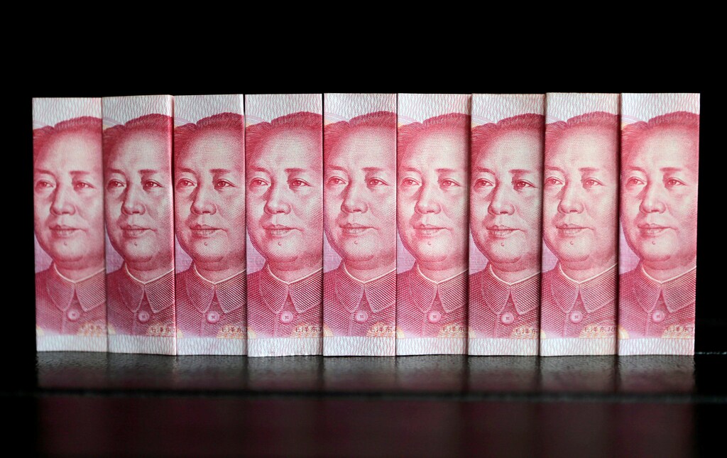 Chinese 100 yuan banknotes are seen in this picture illustration taken July 11, 2013. REUTERS/Jason Lee/File Photo - RTSRJEQ
