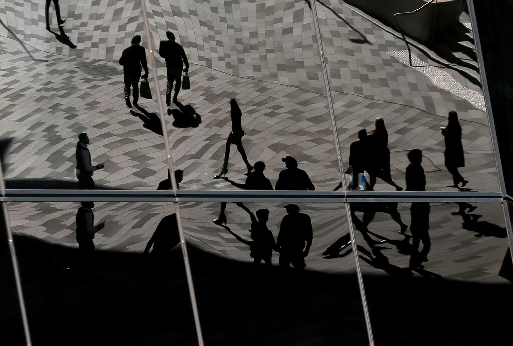 Workers are reflected in an office building's windows in Sydney's Barangaroo business district in Australia's largest city, May 8, 2017. REUTERS/Jason Reed - RC11A5782D60
