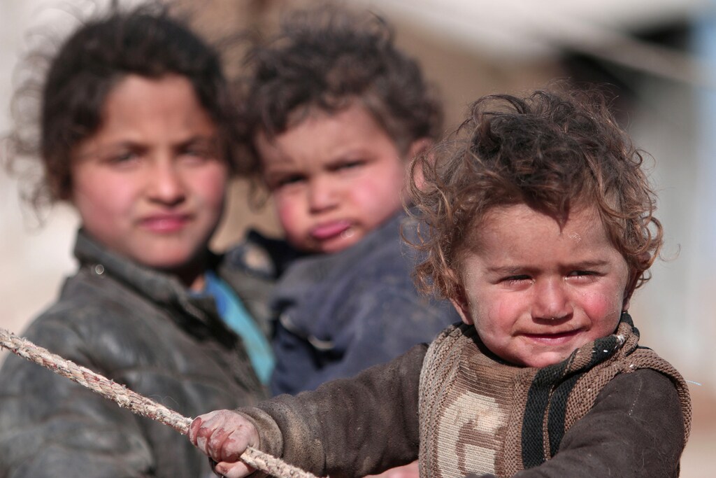 Internally displaced Syrian children who fled Raqqa city stand near their tent in Ras al-Ain province, Syria January 22, 2017. REUTERS/Rodi Said TPX IMAGES OF THE DAY - RTSWUCG