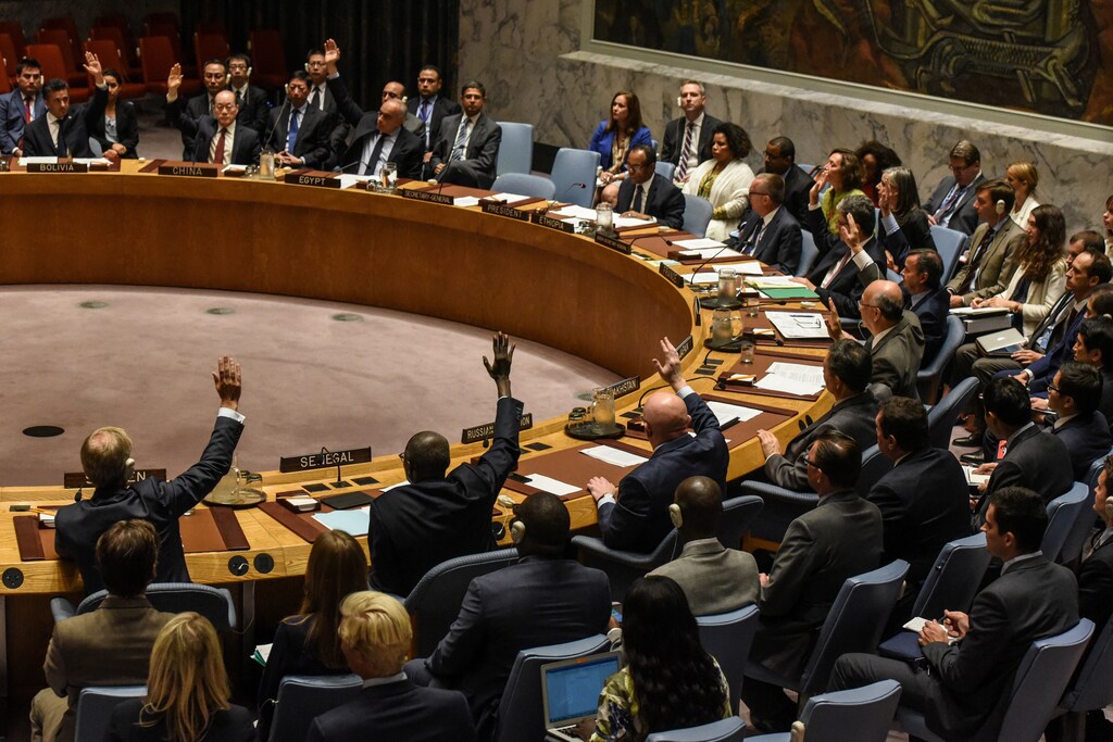 Ambassadors to the UN vote during a United Nations Security Council meeting on North Korea in New York City, U.S., September 11, 2017. REUTERS/Stephanie Keith - RC13A6070E20