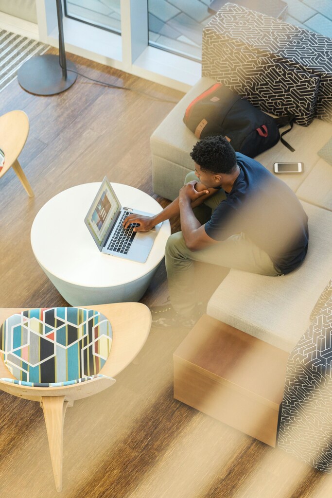 a man sitting at his laptop