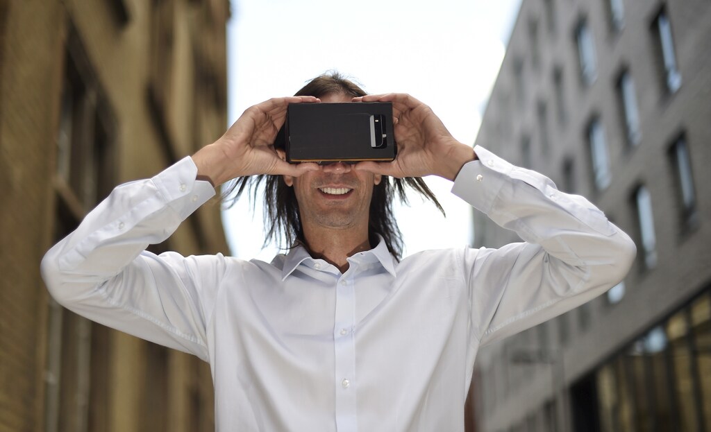 Trillenium Founder and CEO Hrvoje Prpic poses with a pair of his 'virtual shopping' spectacles in central London September 2, 2015. Trillenium is a start-up that creates virtual stores for brands aimed at marrying the experience of real-life shopping with the convenience of e-commerce on smartphones and computers. Shoppers can tour the virtual store by focusing their gaze on products, browse items from different angles and socialize with friends online, bringing to life an e-commerce industry currently dominated by search boxes and static pictures. To match story BRITAIN-RETAIL/TRILLENIUM Picture taken September 2, 2015. REUTERS/Toby Melville - RTSPMI