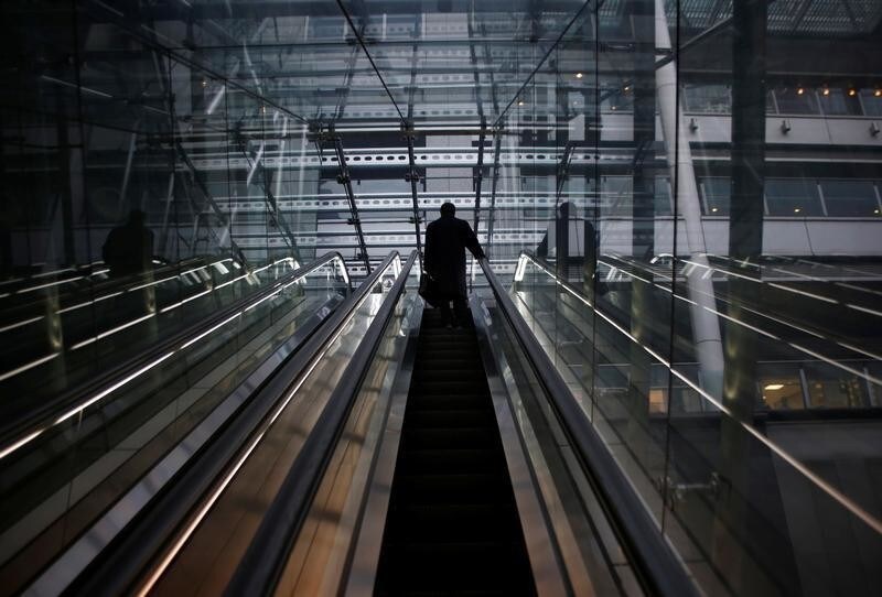 A man rides an escalator at a commercial building in Tokyo, Japan December 26, 2017. REUTERS/Kim Kyung-Hoon - RC15E3054590
