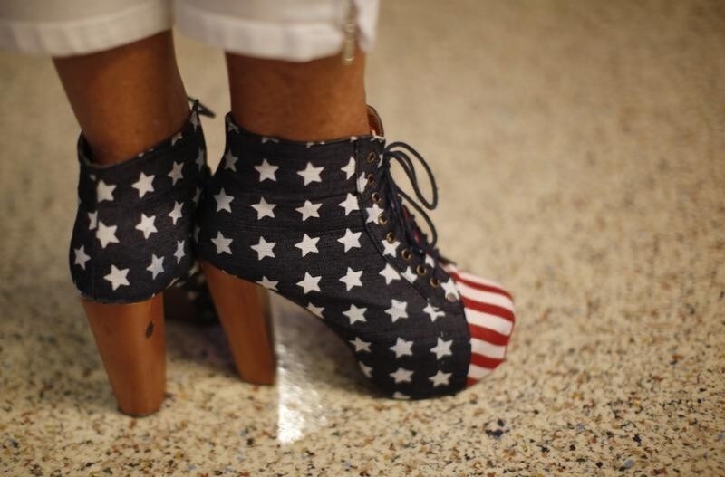 A convention goer wears Stars and Stripes heels during the second session of the 2012 Republican National Convention in Tampa, Florida, August 28, 2012. REUTERS/Rick Wilking (UNITED STATES - Tags: FASHION POLITICS ELECTIONS) - RTR377IL
