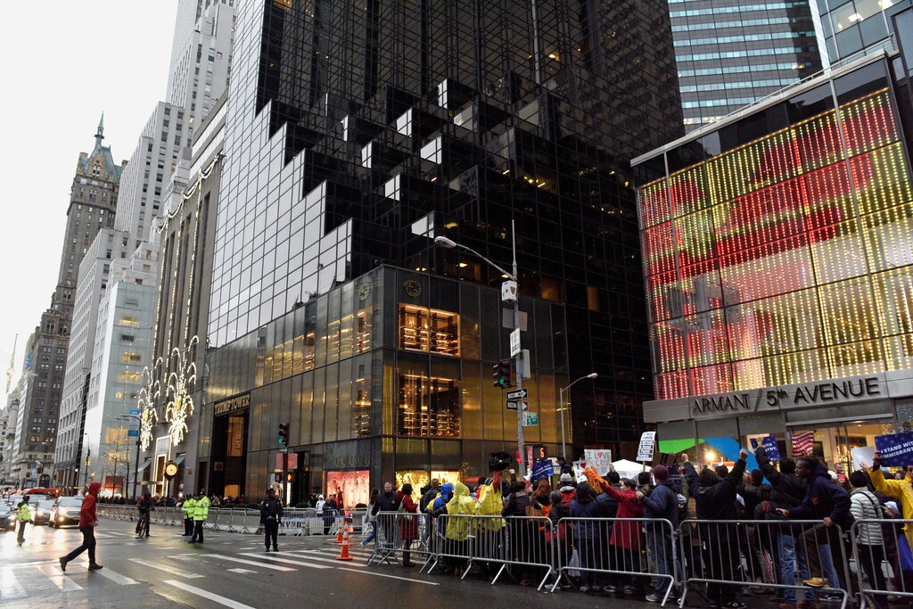People protest outside Trump Tower during a demonstration organized by the New York Immigration Coalition against President-elect Donald Trump in the Manhattan borough of New York, U.S., December 18, 2016. REUTERS/Darren Ornitz - RTX2VKXW