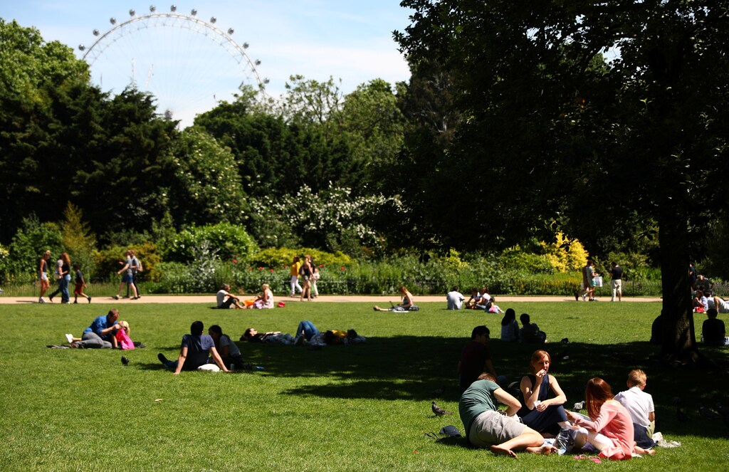People relax on a sunny day in Green Park in London, Britain June 3, 2017. REUTERS/Neil Hall - RTX38TUB