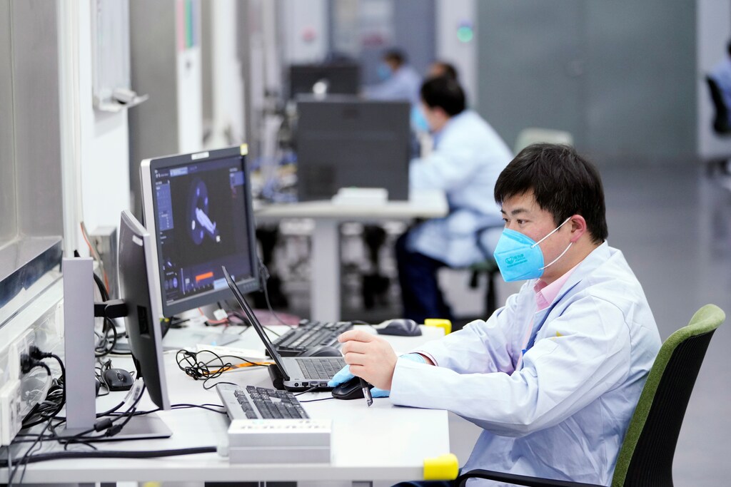 An employee wearing a face mask is seen at a workshop of computed tomography (CT) scanners of medical device firm Siemens Healthineers in Shanghai, China, as the country is hit by an outbreak of a new coronavirus, Coronavirus china virus health healthcare who world health organization disease deaths pandemic epidemic worries concerns Health virus contagious contagion viruses diseases disease lab laboratory doctor health dr nurse medical medicine drugs vaccines vaccinations inoculations technology testing test medicinal biotechnology biotech biology chemistry physics microscope research influenza flu cold common cold bug risk symptomes respiratory china iran italy europe asia america south america north washing hands wash hands coughs sneezes spread spreading precaution precautions health warning covid 19 cov SARS 2019ncov wuhan sarscow wuhanpneumonia pneumonia outbreak patients unhealthy fatality mortality elderly old elder age serious death deathly deadly