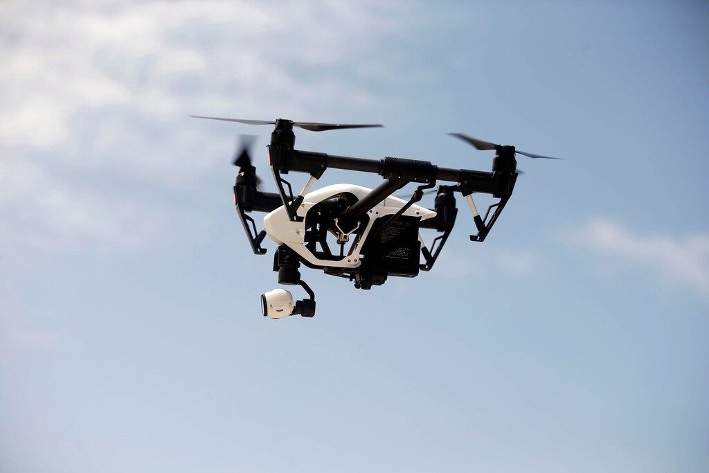 A DJI Inspire drone hovers during a drone training session for Somali police in Mogadishu, Somalia May 25, 2017. Picture taken May 25, 2017. REUTERS/Feisal Omar - RTX37PVN