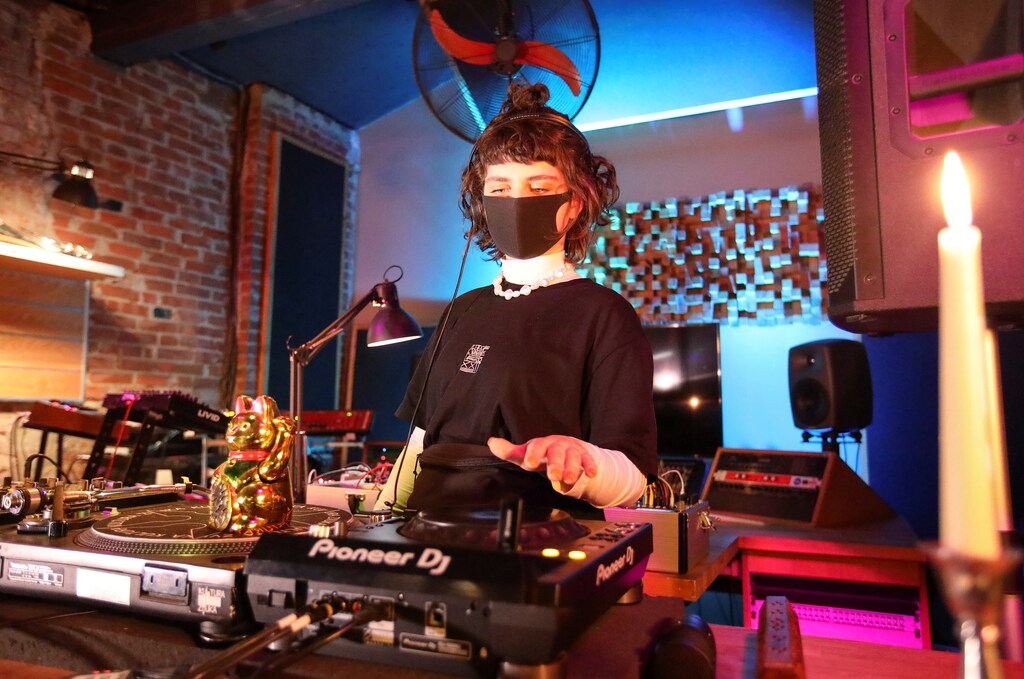 Ukrainian DJ Olga Udovenko plays music during an online broadcast in the empty "Culture of Sound" nightclub, after local authorities imposed restrictions on public gatherings as a measure to prevent the spread of coronavirus disease (COVID-19), in Kharkiv, Ukraine March 21, 2020. Picture taken March 21, 2020. REUTERS/Vyacheslav Madiyevskyy - RC2TPF9RAUAW