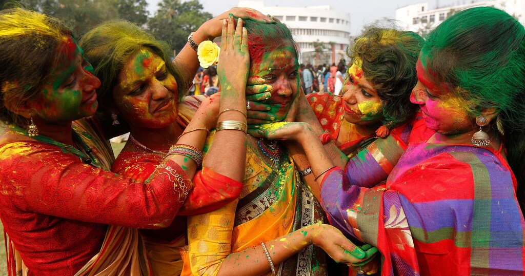 Students of Rabindra Bharati University smear each other with colour powder during Holi, the Festival of Colours, celebrations inside the university campus in Kolkata, India, March 9, 2017