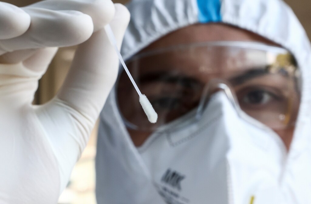 A health worker holds a swab stick at an antigen test station for the coronavirus disease (COVID-19), in Vienna, Austria, September 23, 2020