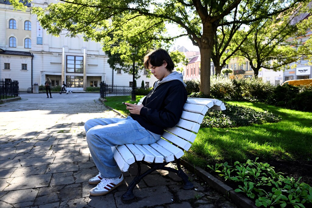 Gen Z Ukrainian teenager Roman Biletskyi ,18, takes rest at a park during a walk through the city, in Kosice, Slovakia, October 21, 2024. Roman Biletskyi has been living alone without his family in Slovakia for more than a year, where he left before turning 18, when they are banned from traveling abroad due to the war. He met his family months later, when they came to visit him in Kosice.