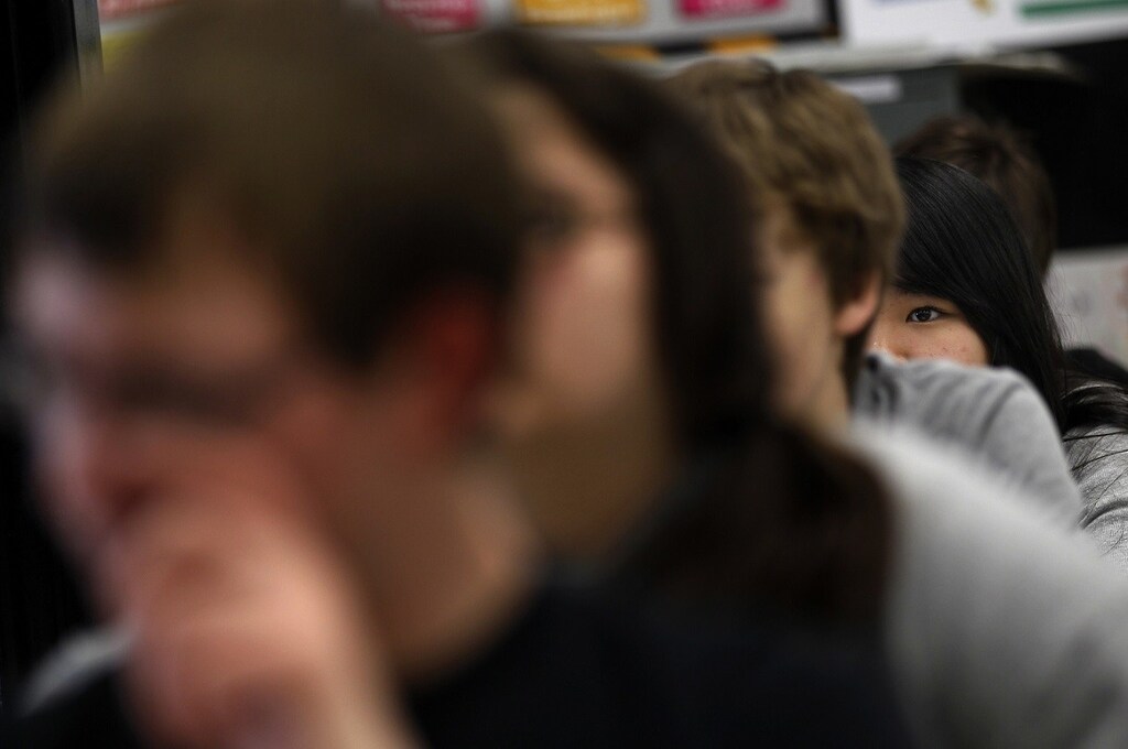Joy Cheng, a foreign exchange student from Taipei, Taiwan, listens to her junior high science teacher at Grant-Deuel School in Revillo, South Dakota February 13, 2012. This year, 11 students from China, Thailand, Germany and elsewhere account for nearly 20% of high school enrollment, bringing cash and a welcome splash of diversity to an isolated patch of the Great Plains. Grant-Deuel is not alone. Across the United States, public high schools in struggling small towns are putting their empty classroom seats up for sale. Picture taken February 13. To match Insight USA-SCHOOLS/FOREIGN REUTERS/Jim Young (UNITED STATES - Tags: EDUCATION SOCIETY) - RTR2Z0K8