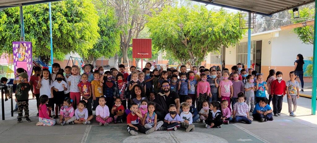 The image shows a group of children, illustrating the importance of climate education on their future