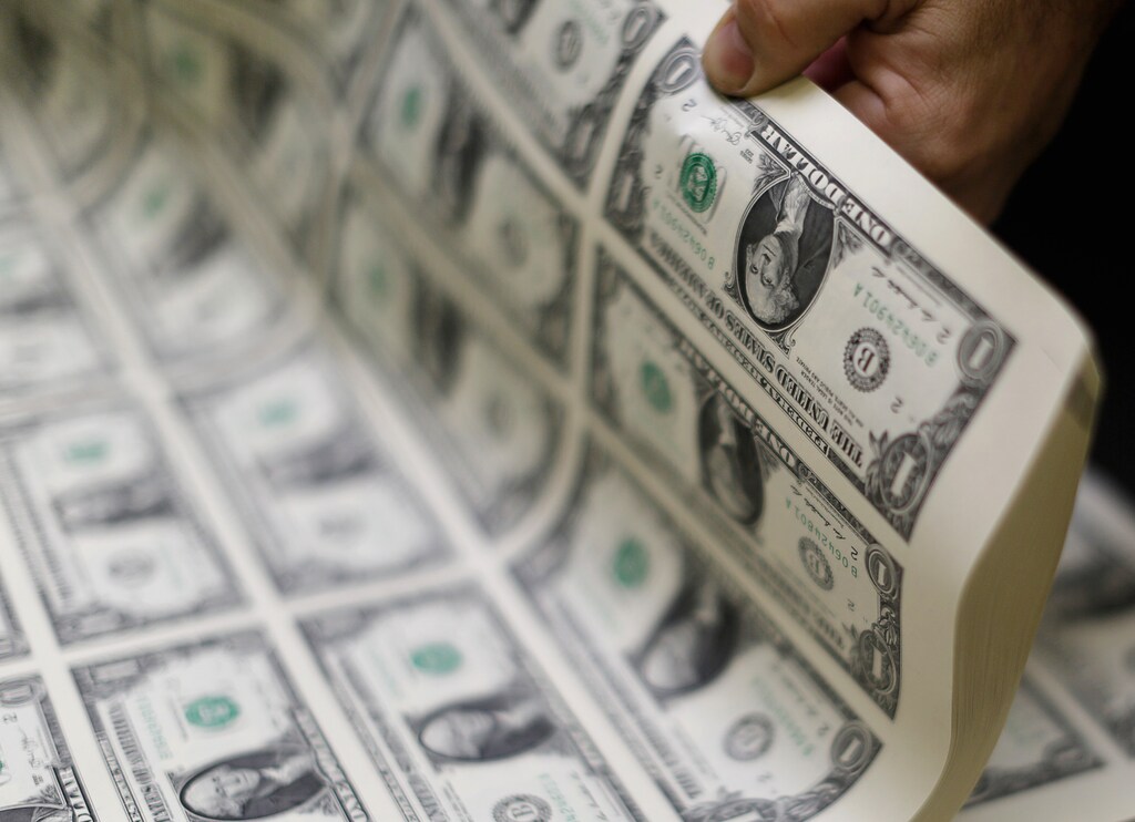 United States one dollar bills are curled and inspected during production at the Bureau of Engraving and Printing in Washington November 14, 2014. REUTERS/Gary Cameron (UNITED STATES - Tags: BUSINESS POLITICS) - GM1EABF07N501