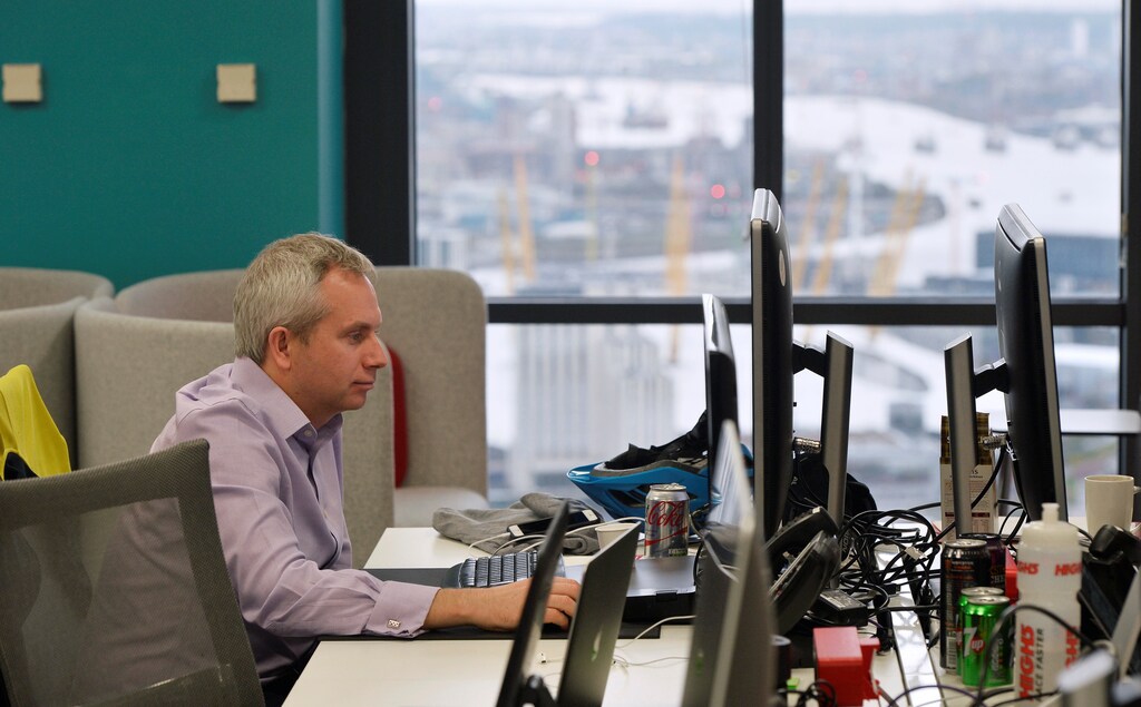 A UBS employee works in the UBS "fintech lab" at Canary Wharf in London, Britain, October 19, 2016. REUTERS/Hannah McKay - RTX2PJJ5